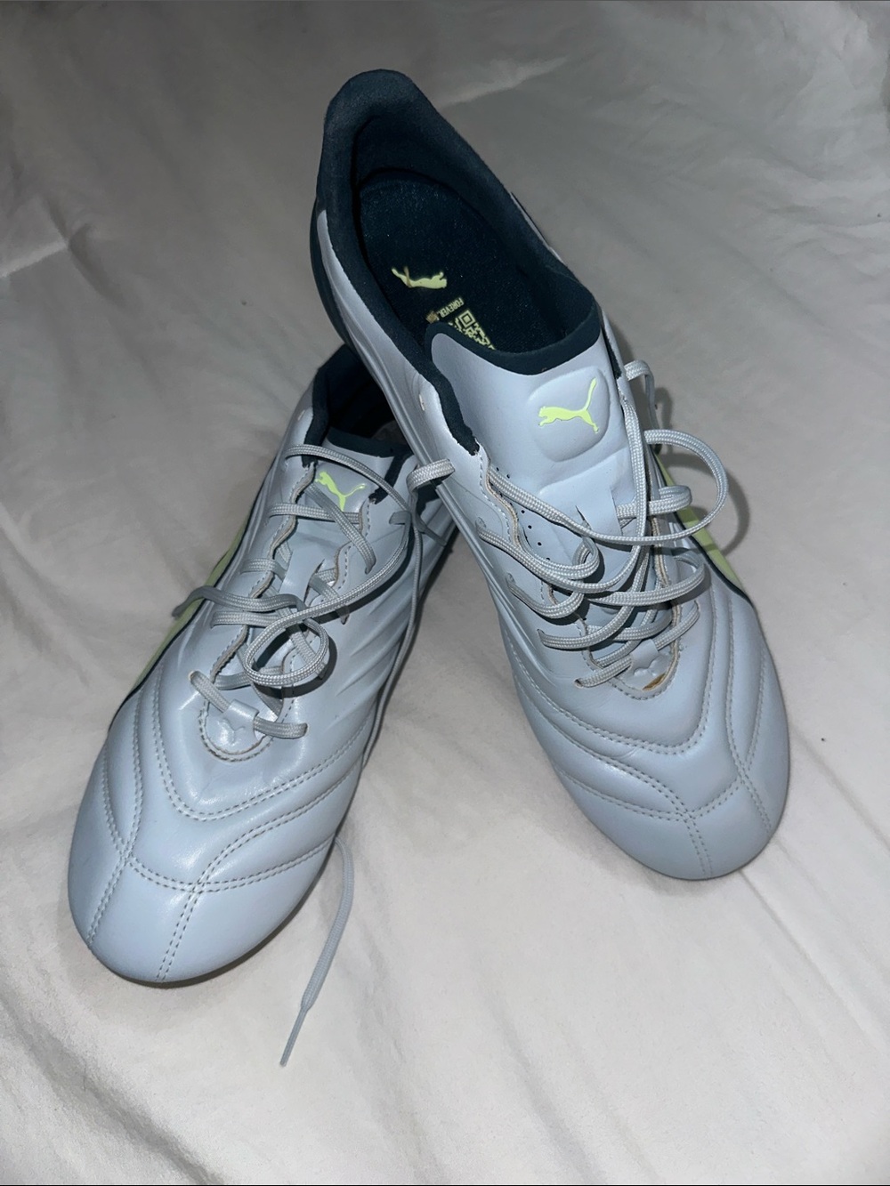 Puma Men’s White Athletic Shoes with Neon Yellow Logo
